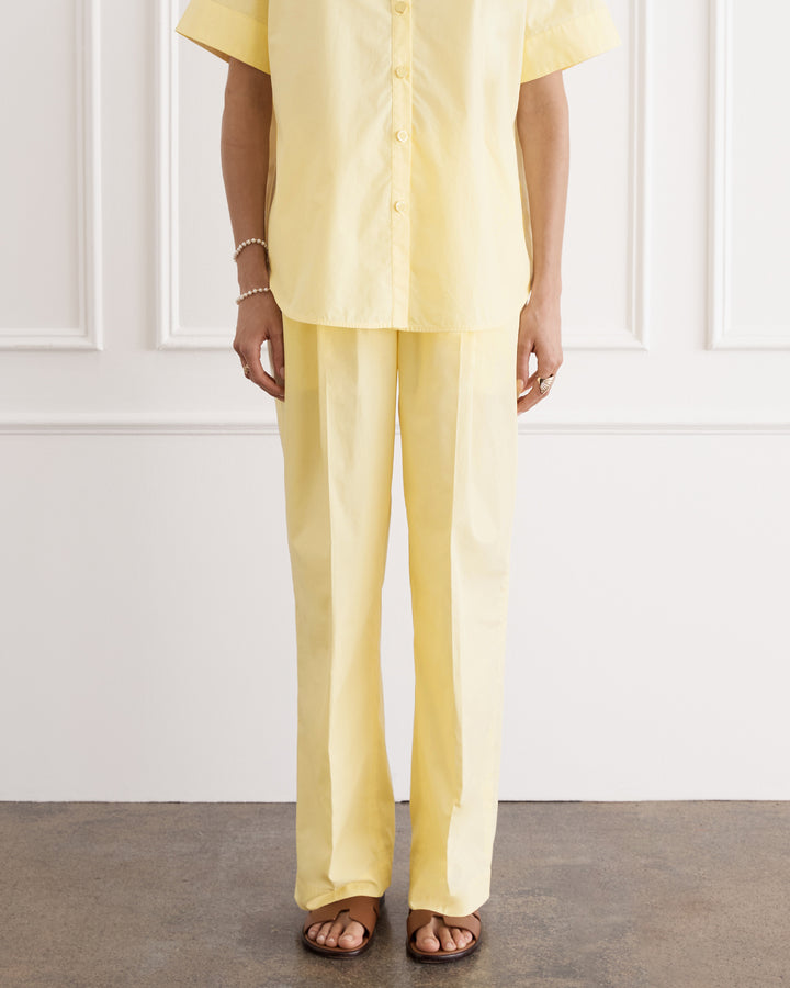 Yellow pleated trousers